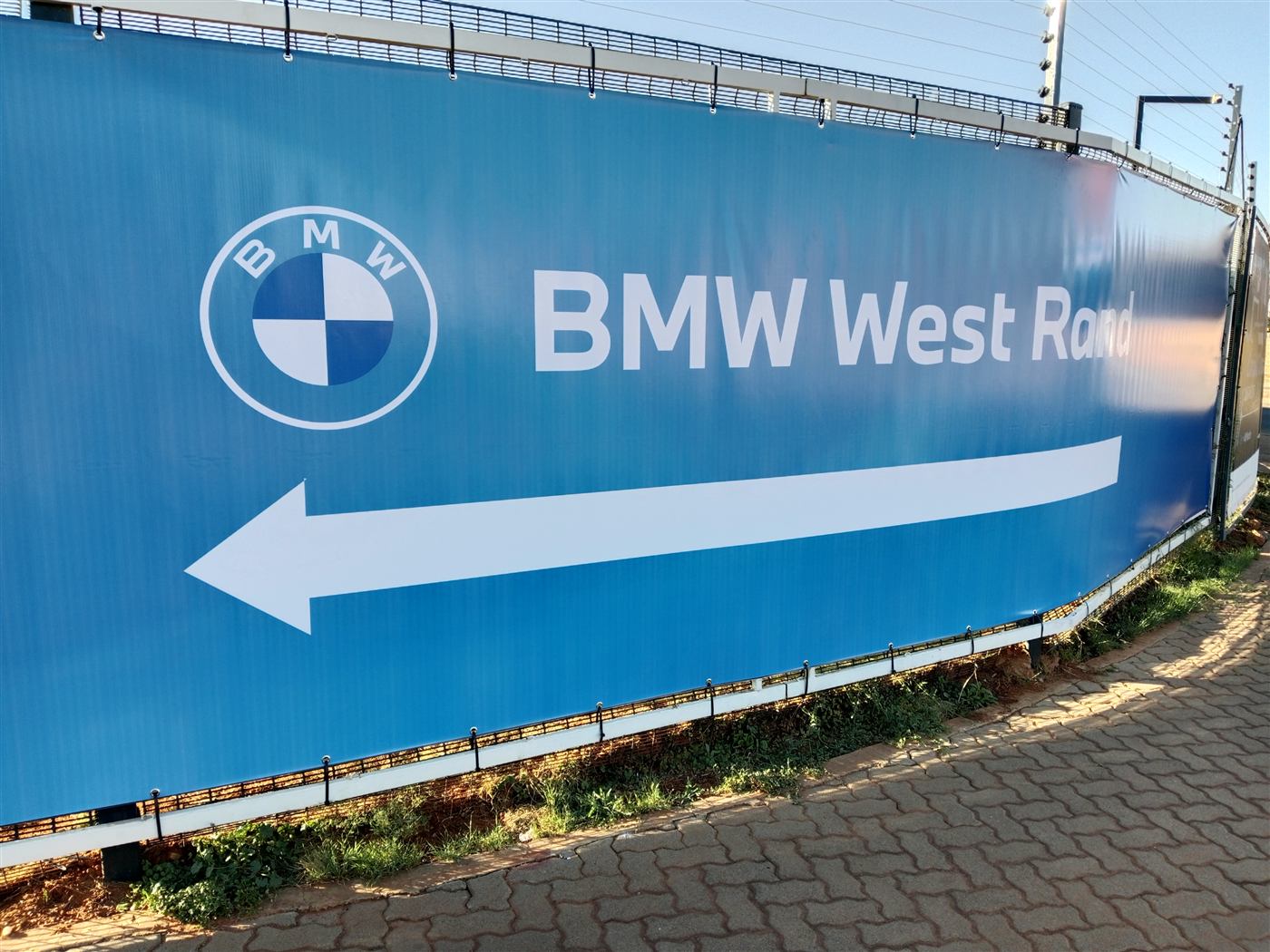 BMW West Rand branded fence hoarding wrap