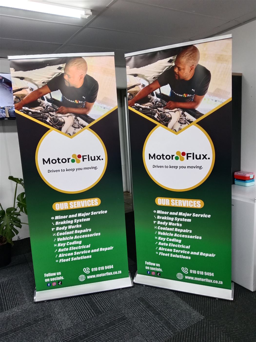 MotorFlux branded pull-up banners