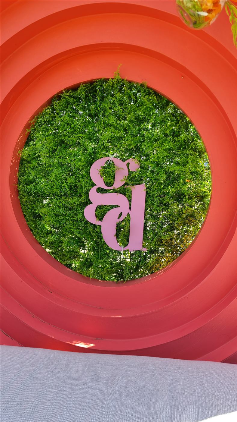 Close-up detail of a red circular event arch