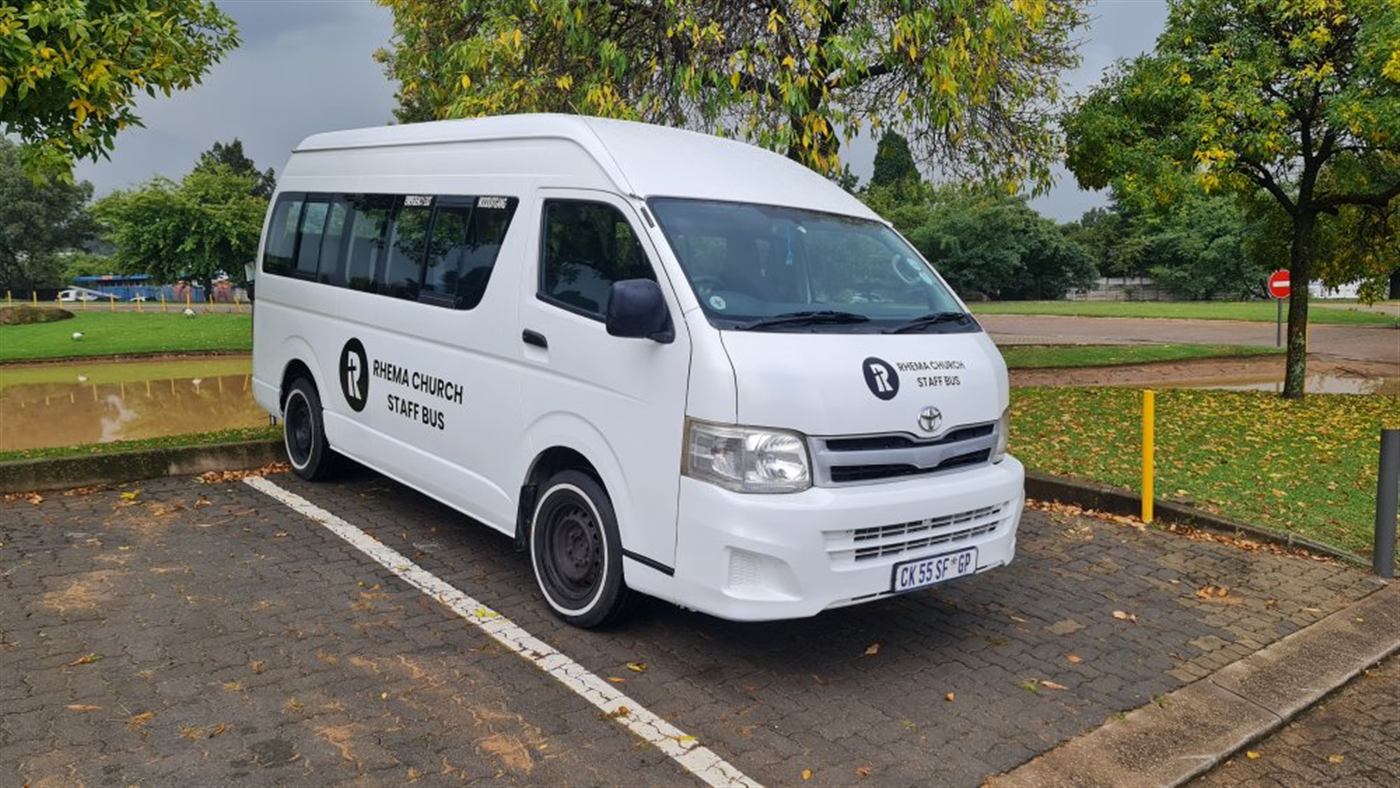 Rhema Church staff bus front three-quarter view