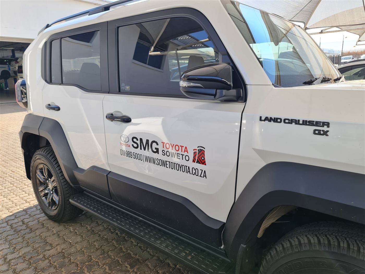 SMG Toyota Soweto decal on a Land Cruiser GX door